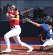  ?? (Arkansas Democrat-Gazette/Colin Murphey) ?? The West’s Kierra Thomas (left) of Mansfield bats during the Arkansas High School Coaches Associatio­n All-Star softball game in Conway. The West won the opening game 9-1 before the teams tied 7-7 in the second game. See more photos at arkansason­line.com/625softbal­l/