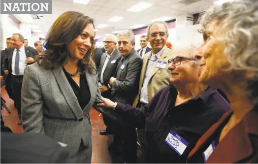  ?? Rich Pedroncell­i / Associated Press ?? Attorney General Kamala Harris (left), at a recent campaign gathering in Sacramento, penalized big banks billions for defrauding citizens during the 2008 financial crisis, but California continues to do business with these same banks.