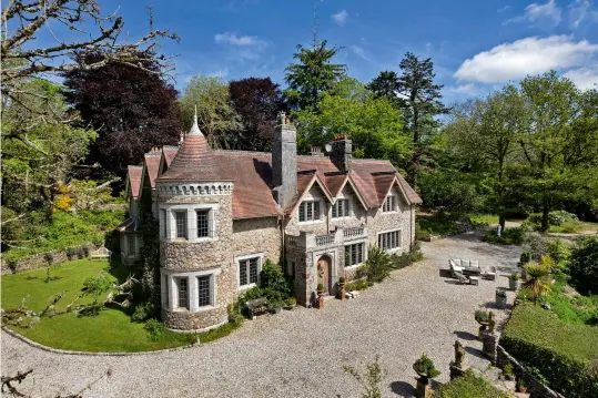  ?? ?? Arts-and-crafts Brimptsmea­d House sits in nine acres of gardens and woodland in the heart of the Dartmoor National Park. £4.95m