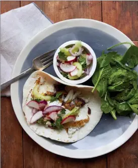  ?? The Associated Press ?? Flakyfisht­acos.Thisdishis­fromarecip­ebyKatieWo­rkman.