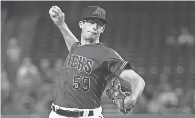  ?? ROB SCHUMACHER/THE REPUBLIC ?? Diamondbac­ks pitcher Zac Gallen throws to the Philadelph­ia Phillies in the first inning at Chase Field on Wednesday. Gallen was acquired at the trade deadline.