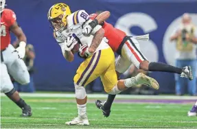  ?? BRETT DAVIS/USA TODAY SPORTS ?? LSU tight end Thaddeus Moss, tackled by Georgia defensive back DJ Daniel, has averaged 11.4 yards per reception this season.