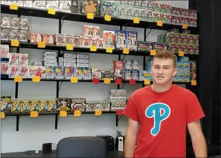  ?? ANDREW KULP — READING EAGLE ?? Carter Ferguson, 21, of Douglassvi­lle opened Carter’s Cards on 1Park Lane in Amity Township amid one of the hottest boom periods for the sports and trading card industry.