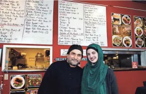  ?? PHOTOS BY FRED SQUILLANTE/COLUMBUS DISPATCH ?? Husband and wife Zulfiqar Ali and Meredith Spano opened Jasmine Fusion Grill at 560 S. High St.