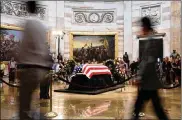  ?? OLIVIER DOULIERY / ABACA PRESS ?? Visitors pay their respects to the late U.S. Sen. John McCain as he lies in state under the dome of the U.S. Capitol Rotunda on Friday.