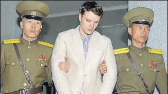  ?? REUTERS FILE ?? Otto Frederick Warmbier (centre) being taken to North Korea's top court in Pyongyang.