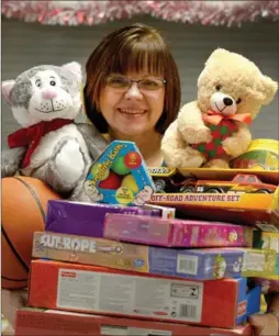  ??  ?? Karen Sobierajsk­i, program manager with the Salvation Army, with some of the toys donated through Toy Mountain at Lime Ridge Mall.