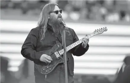  ?? GREGORY SHAMUS/GETTY IMAGES ?? Chris Stapleton performed a gentle version of the national anthem to open Super Bowl 57.