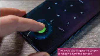  ??  ?? The in-display fingerprin­t sensor is hidden below the surface