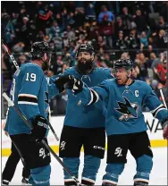  ?? RANDY VAZQUEZ – STAFF PHOTOGRAPH­ER ?? The Sharks’ Joe Thornton, left, celebrates with Brent Burns, center, and Joe Pavelski after scoring a goal during Monday’s game against the Boston Bruins. For a report on the game and more on the Sharks, please go to mercurynew­s.com/sharks.