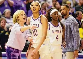  ?? Derick Hingle/Associated Press ?? LSU head coach Kim Mulkey talks with forward Angel Reese (10) during the second half against Georgia in Baton Rouge, La., on Feb. 2. One thing’s nearly certain when LSU’s Angel Reese and South Carolina’s Aliyah Boston face off Sunday in a showdown of the country’s last two undefeated teams: Someone, if not both, will come away with a double-double.