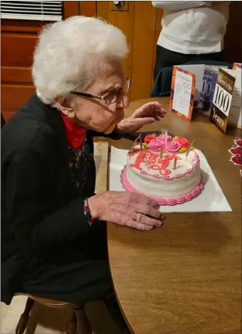  ?? COURTESY LILI CIBULSKI ?? Billerica’s Phyllis Cibulski shows that you can never grow out of blowing out candles on a birthday cake as she celebrates her 100th birthday Feb. 23, 2024with a surprise party put on by her family.