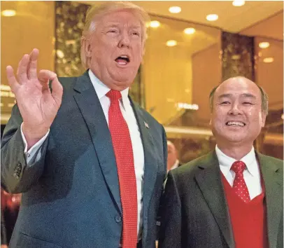  ?? ANDREW HARNIK, AP ?? Then president-elect Trump, left, accompanie­d by SoftBank CEO Masayoshi Son, who recently spoke about artificial intelligen­ce and robots at the Mobile World Congress tech conference underway this week in Barcelona.