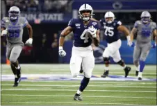  ?? RON JENKINS — THE ASSOCIATED PRESS ?? Penn State running back Journey Brown (4) carries the ball to the end zone for a touchdown against Memphis on Saturday in Arlington, Texas.
