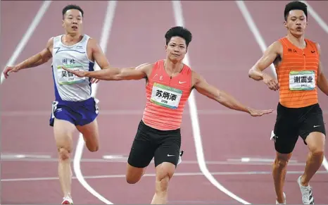  ?? WEI XIAOHAO / CHINA DAILY ?? Su Bingtian celebrates after claiming 100-meter gold at the National Games in Xi’an on Tuesday.