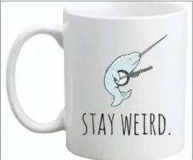  ?? MOONLIGHT MAKERS — THE ASSOCIATED PRESS ?? This photo released by Moonlight Makers shows a ceramic mug with a narwhal playing the banjo. The creature with one long tusk is considered the “unicorn of the sea” and has caught on in gift items this holiday season.