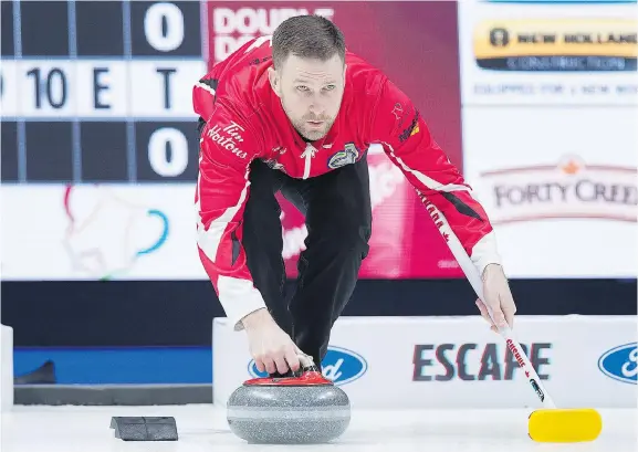  ?? ANDREW VAUGHAN/THE CANADIAN PRESS ?? Team Canada skip Brad Gushue prepares to deliver a rock against Alberta in the Brier championsh­ip game on Sunday in Regina.