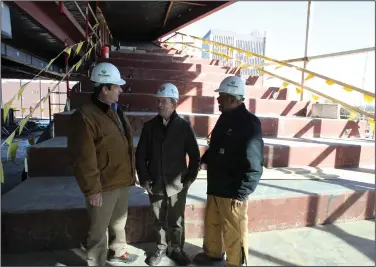  ?? (Arkansas Democrat-Gazette/Dale Ellis) ?? Win Trafford (from left), director of business developmen­t with East Harding Constructi­on, Fred Reed of Reed Architectu­ral Firm and Patrick Booth, senior site superinten­dent with East Harding Constructi­on, go on a recent inspection tour of the Pine Bluff Library, which is under constructi­on.