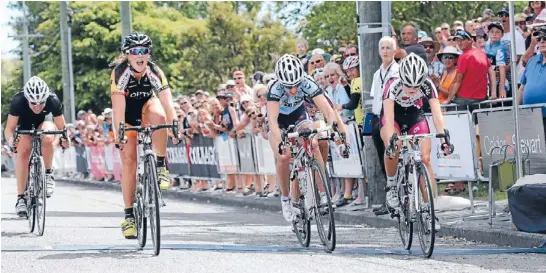  ?? Photo: Don Scott/fairfax NZ ?? Celebratio­n time: The emotion shows as Courteney Lowe, left, beats Olympian Linda Villumsen, third, and Emma Crum, second, to the line in the national road championsh­ip in Christchur­ch.