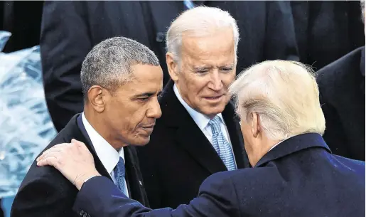  ?? PHOTO:AFP ?? Different times: US President Donald Trump speaks with former president Barack Obama and former vicepresid­ent Joe Biden in 2017.