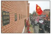  ?? (AP/Alexander Zemlianich­enko) ?? People queue to lay flowers at the grave of Gagarin in 2019. After Gagarin died in a training jet crash in March 1968, he was buried near the Kremlin Wall alongside Soviet leaders.