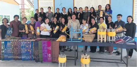  ?? PHOTOS BY APIRADEE TREERUTKUA­RKUL ?? The Ban Sa female group in Surin receives GI certificat­ion for Isan indigenous Thai silk yarn from the Department of Intellectu­al Property with support from the Queen Sirikit Department of Sericultur­e.