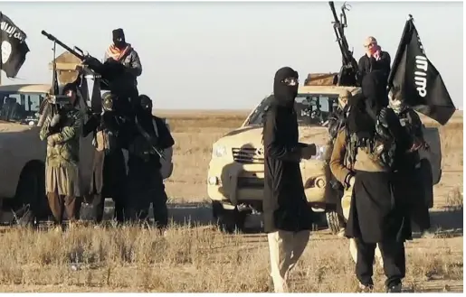  ?? ISIL / AFP / Gett y Imag es ?? ISIL militants gather at an undisclose­d location in Iraq in 2014.