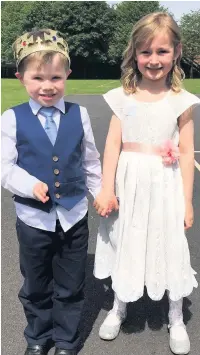  ??  ?? Prestbury Primary School’s Ted and Amelia, from Reception, played a mini Prince Harry and Mini Meghan