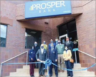  ?? SUBMITTED PHOTO ?? Chester County community leaders joined Prosper Bank on Tuesday to celebrate the bank’s name change from Coatesvill­e Savings Bank to Prosper Bank. Attending the ribbon- cutting ceremony in Coatesvill­e were, from left, in front row: Latifah Lamb, Prosper Bank market manager; Doug Byers, Prosper Bank chief banking officer; Joseph Carroll, Prosper Bank board chairman; Chester County Commission­ers Josh Maxwell and Marian Moskowitz. In the second row, from left, are: Bill Schoell, chief of staff for state Rep. Dan Williams ( D- 74th Dist.); Sonia Huntzinger, Coatesvill­e 2nd Century Alliance economic developmen­t administra­tor; Ricky Campbell, adviser to Williams; Gary Smith, Chester County Economic Developmen­t Council president and CEO; and James Logan, city manager, city of Coatesvill­e.