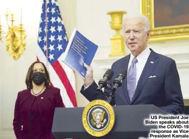  ?? AFP ?? US President Joe Biden speaks about the COVID-19 response as Vice President Kamala Harris looks on before signing executive orders in the State Dining Room of the White House in Washington on Thursday.