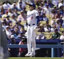  ?? RYAN SUN — THE ASSOCIATED PRESS ?? The Dodgers’ Shohei Ohtani reacts after getting stranded at third base as Freddie Freeman grounds out in the eighth inning Wednesday.