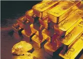  ?? AP ?? In this undated handout photo released by Newmont Mining Corporatio­n, gold nuggets and bars are shown.