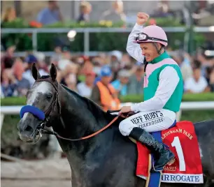  ?? AFP ?? Jockey Mike smith celebrates atop Arrogate after winning the $12 Million Pegasus World Cup Invitation­al at Gulfstream Park on January 28, 2017 in Hallandale, Florida. —