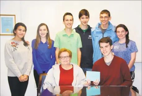  ?? Jennifer Price / Contribute­d photo ?? Dylan Karpel, sitting on the right, jumped into the Coginchaug River to save Bernadette Graham’s dog, Rex. Karpel was on a practice run for the Middletown High School indoor track team. Standing, from left, are Alexa Gonzalez, Ariana Monarca,...