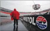  ??  ?? A fan walks along the wall at Bristol Motor Speedway at a NASCAR Monster Energy auto race Sunday in Bristol, Tenn.