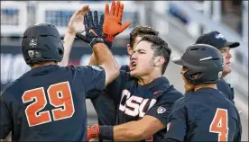  ?? NATI HARNIK / ASSOCIATED PRESS ?? Oregon State’s K.J. Harrison (center) celebrates his sixth-inning grand slam Monday night with Steven Kwan (4) and Jack Anderson (29).