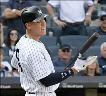  ?? BILL KOSTROUN / THE ASSOCIATED PRESS ?? New York Yankees pinch hitter Aaron Judge reacts after striking out during the ninth inning in the first game against the Cleveland Indians Wednesday at Yankee Stadium. The Yankees were swept by the Indians.