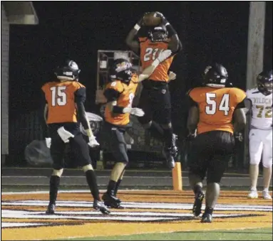  ?? Photo by Alexis Meeks ?? Malvern’s Jacobe Hart (21) celebrates with teammates Chace McCalister (9), Carter Martin (15), and Adavion Jenkins (54) after scoring a touchdown against Trumann Friday night. Hart had a total of 14 carries for 83 yards and three touchdowns in Malvern’s win Friday.