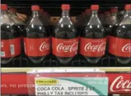  ?? AP PHOTO/MATT SLOCUM, FILE ?? A sweetened beverage tax sign is posted by bottles of drinks at a supermarke­t in the Port Richmond neighborho­od of Philadelph­ia.