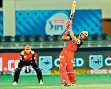  ?? —BCCI ?? Devdutt Padikkal of Royal Challenger­s Bangalore hit a six on way to his half-century in the IPL match against Sunrisers Hyderabad at the Dubai Internatio­nal Cricket Stadium in Dubai on Monday.