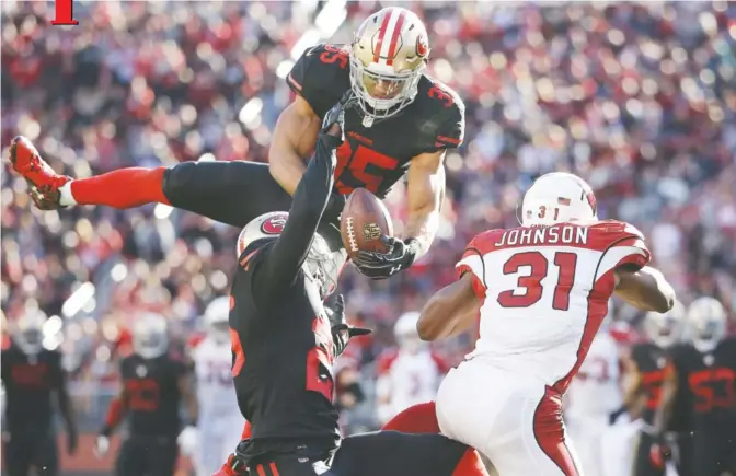  ??  ?? CALIFORNIA: San Francisco 49ers safety Eric Reid (35) breaks up a pass intended for Arizona Cardinals running back David Johnson (31) during the first half of an NFL football game in Santa Clara, California, Sunday. — AP