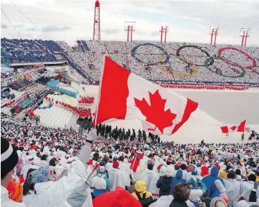  ?? AFP/GETTY IMAGES/FILES ?? Fans cheer the Canadian delegation at the opening ceremony of the Calgary Olympics in February 1988. Calgary’s bid to stage the 2026 Games suffered a crushing blow Tuesday, as residents voted overwhelmi­ngly against hosting it.