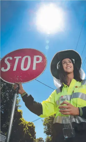  ?? Picture: DEAN MARTIN ?? ACCLIMATIS­ED: Traffic controller Natasha Weller likes working outdoors but says the heat was a shock at first.