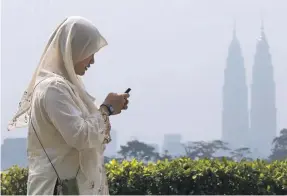  ?? AP ?? Malaysia spent the most in Islamic finance and Muslimfrie­ndly travel sectors