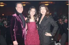  ?? (NWA Democrat-Gazette/Carin Schoppmeye­r) ?? Eric and Elda Scott, with daughter Amelia, help support Mercy Health Foundation of NWA at O’ Night Divine on Dec. 3.