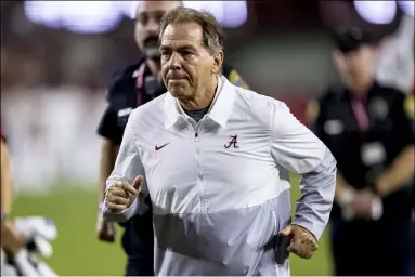  ?? VASHA HUNT — THE ASSOCIATED PRESS ?? Alabama head coach Nick Saban jogs off the field after an NCAA college football game against Southern Mississipp­i, Saturday, Sept. 25, 2021, in Tuscaloosa, Ala.