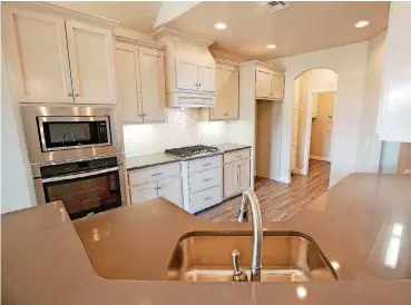  ?? [PHOTO BY STEVE GOOCH, THE OKLAHOMAN] ?? Quartz counters at 7116 NW 152 by Carr Quality Homes.