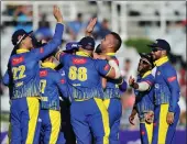  ?? BACKPAGEPI­X ?? BREAKTHROU­GH: Dane Paterson (third from right) is highfived by teammates after an early wicket.