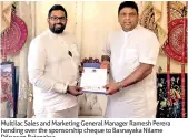  ??  ?? Multilac Sales and Marketing General Manager Ramesh Perera handing over the sponsorshi­p cheque to Basnayaka Nilame Dilruwan Rajapaksa