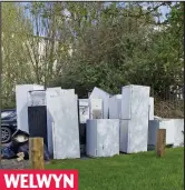  ??  ?? WELWYNOld fridge-freezers piling up in a car park